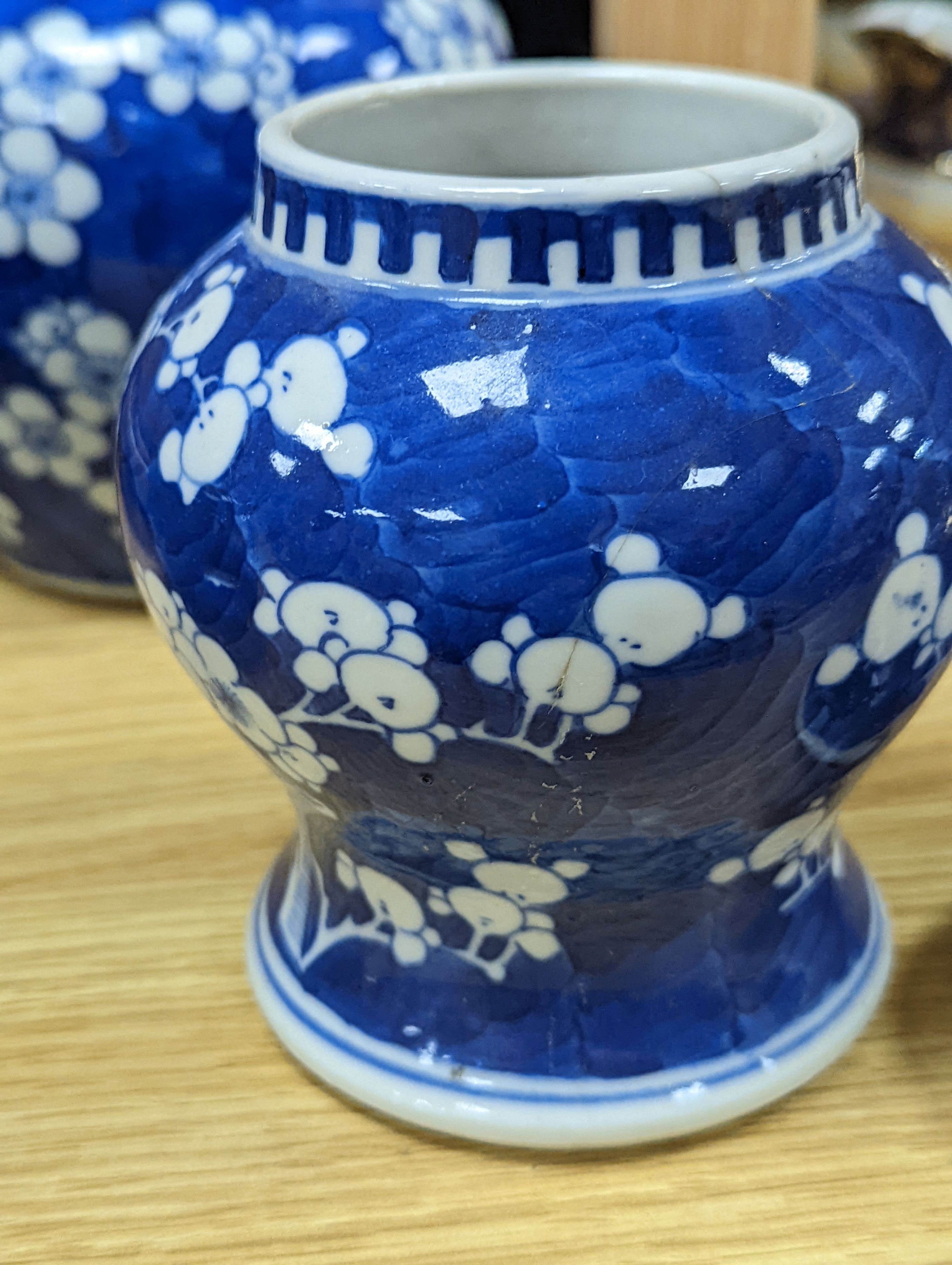 Three Chinese blue and white prunus decorated jars and covers, 19th/20th century, with four character marks 18cm